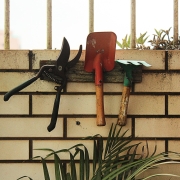 Garden tools on wall of greenhouse