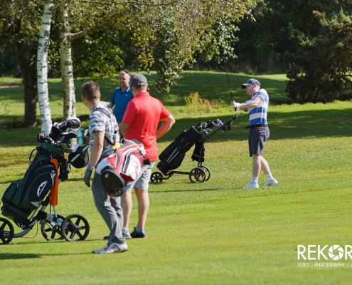 Teams in action during golf day