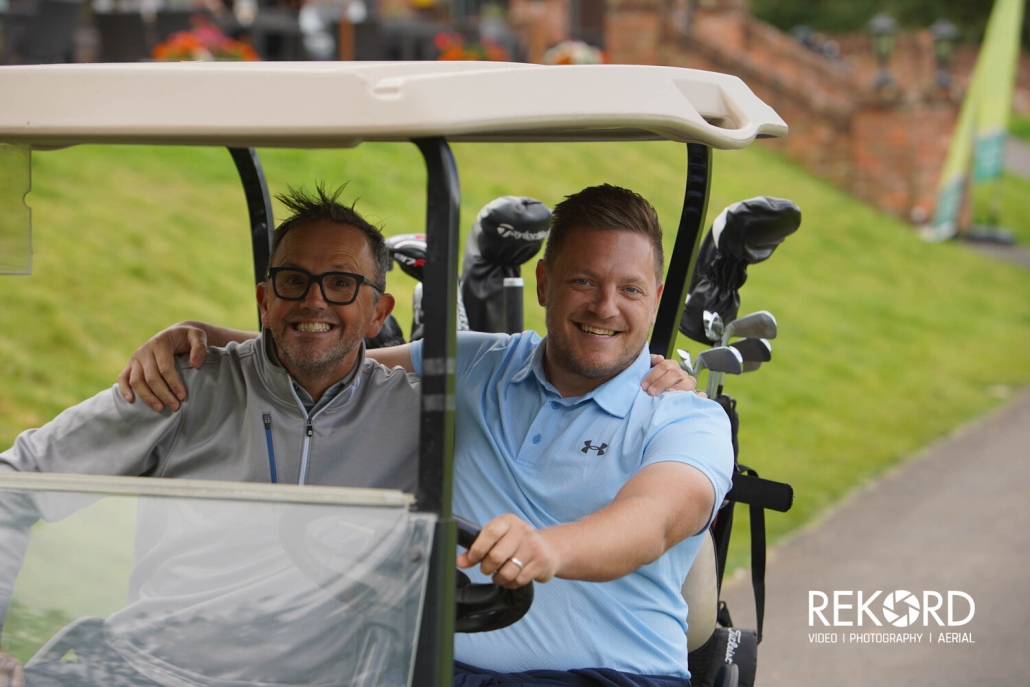 players in buggy at the golf day