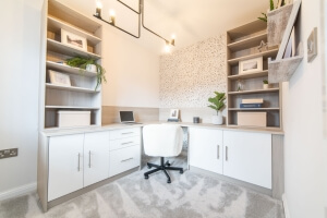 A home office with neural colour cabinets, shelving and chair 