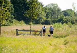 Walkers in Country Park near Cavanna Homes' Equinox development