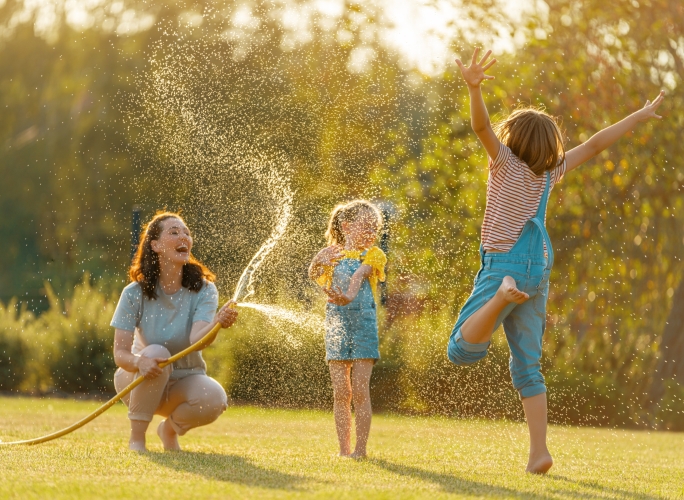 Children playing in green open space