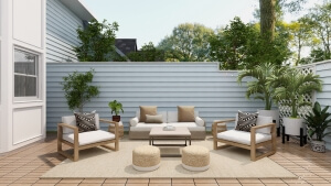 Outdoor seating area with neutral theme and pops of green