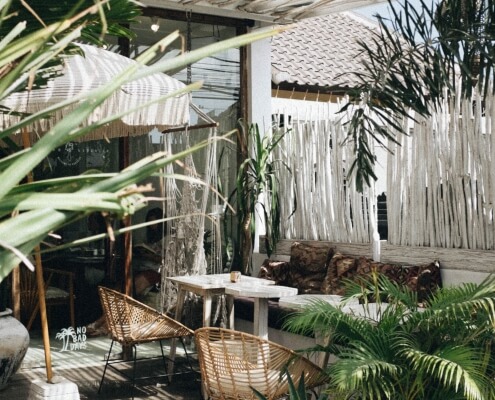 Outdoor seating space, styled with greenery