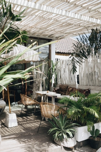 Outdoor seating space, styled with greenery