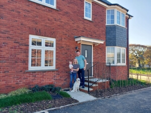Tom and Megan out the front of their third Cavanna Homes