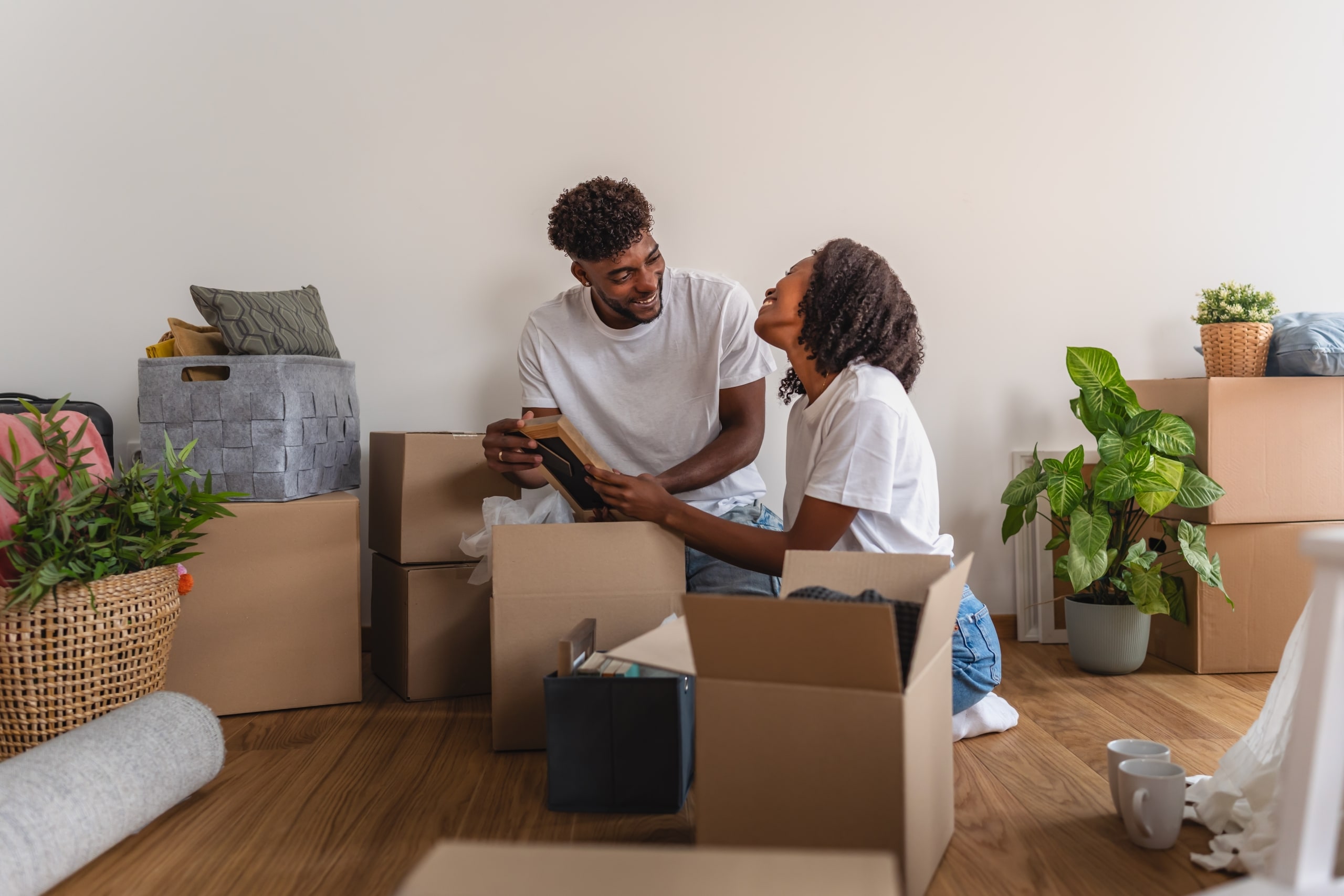 African,American,Couple,Unpacking,Boxes,Together,In,Their,New,Home,